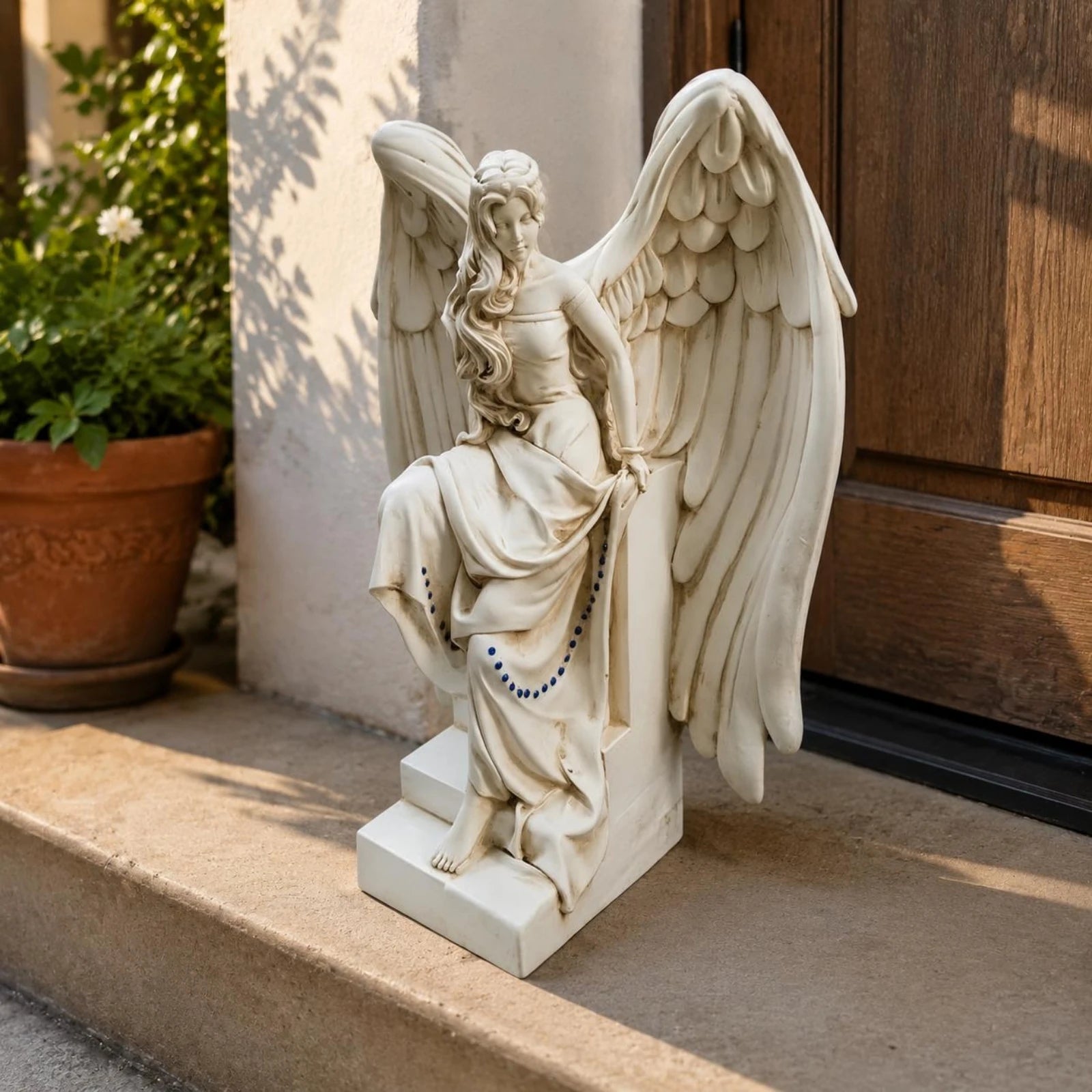 Seated White Angel Figurine with Feathered Wings